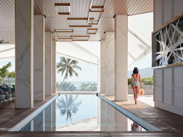 a girl standing beside the pool at Crystalbrook Flynn