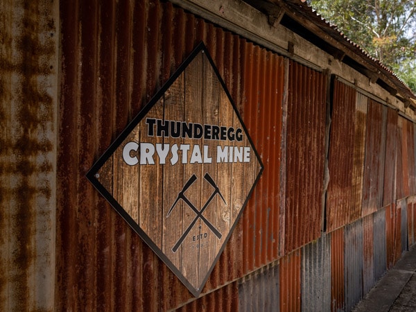 a rustic signage of the Thunderegg Crystal Mine inside Thunderbird Park