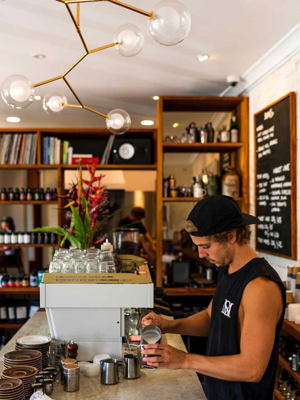 a barista mixing coffee at High Life, Byron Bay