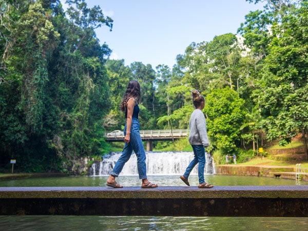 Kids walking past Malanda Falls