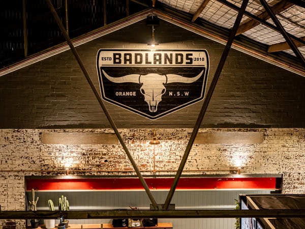 the Badlands Brewery signage on top of the wall