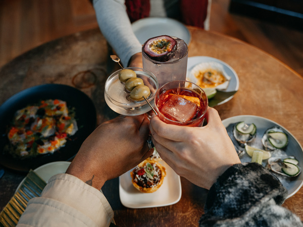 clinking cocktail glasses at Grainery Lane, Ballarat