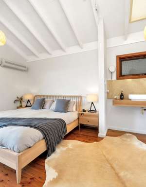 a cosy bedroom at Saddleback Grove, Kiama