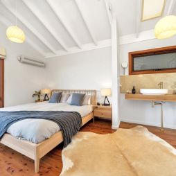 a cosy bedroom at Saddleback Grove, Kiama