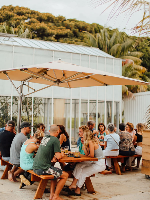 friends enjoying drinks at outdoor tables, Lord Howe Island Brewery