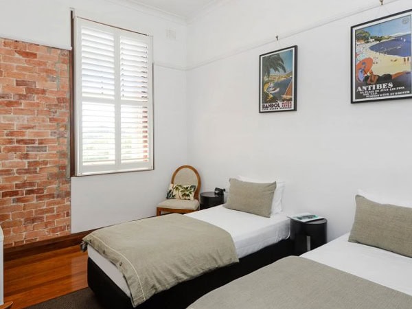 a room with twin beds at The Pier Hotel, Coffs Harbour