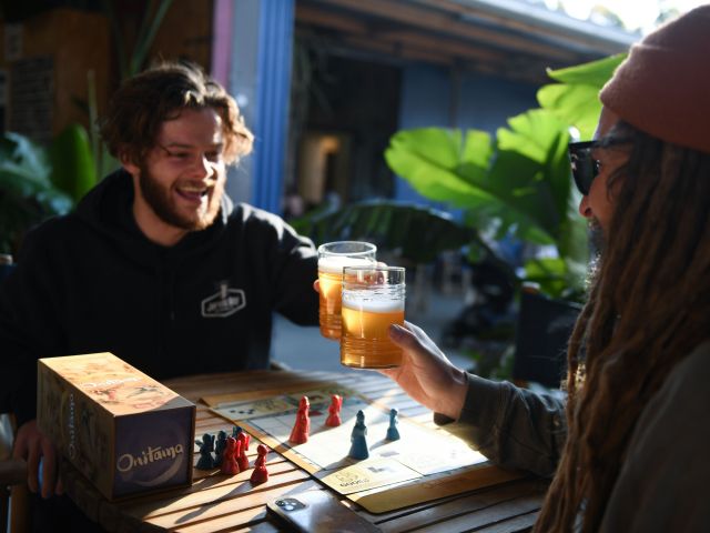 friends enjoying drinks and board game at Jervis Bay Brewing Co.