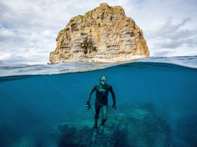 a freediver diving with Dive Jervis Bay