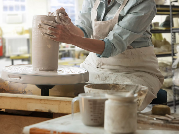 molding a pot using hands at South Coast Ceramics, Kiama