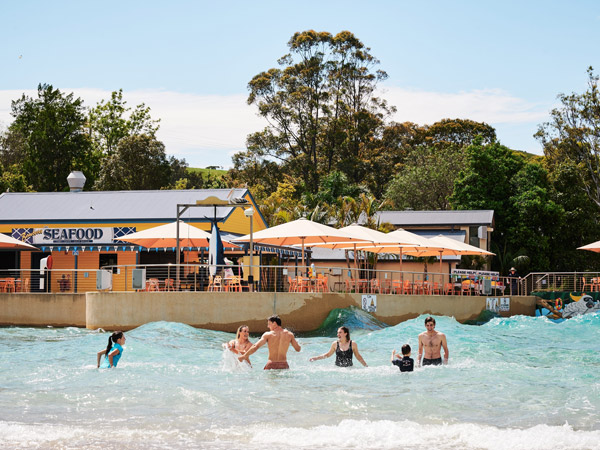a family enjoying in a wave pool at Jamberoo Action Park, Kiama