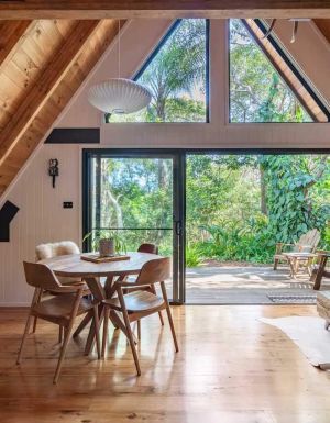 a look inside an A-frame log cabin at Eh Frame, Noosa National Park