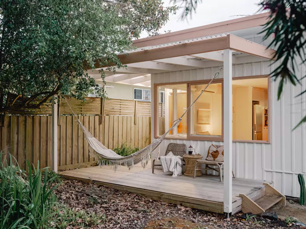 an outdoor deck with a hammock at Las Olas Shack, Phillip Island
