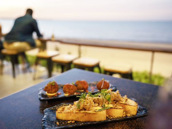 a close-up shot of food on the table at Enzo’s on the Beach, Hervey Bay restaurants