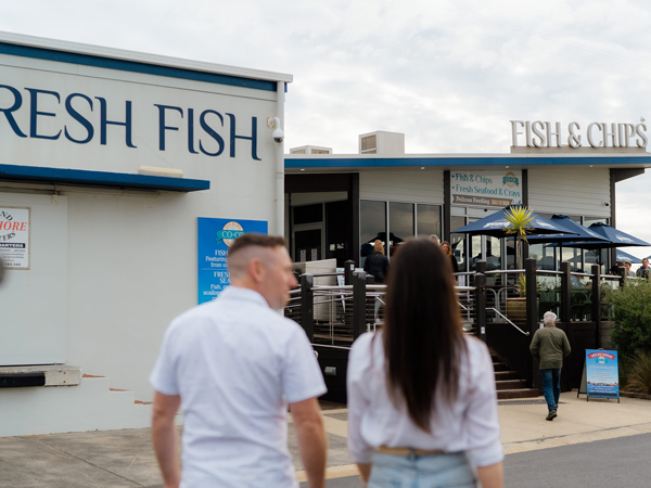 a couple heading to San Remo Fisherman's Cooperative