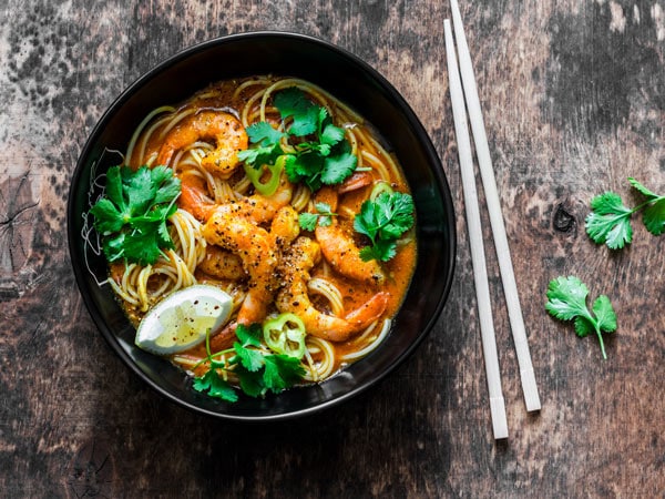 Prawn laksa soup on a table