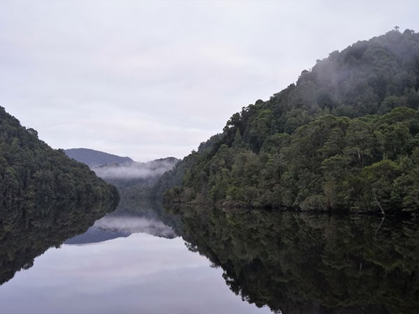 Clouds are reflected off the water on the Franklin River