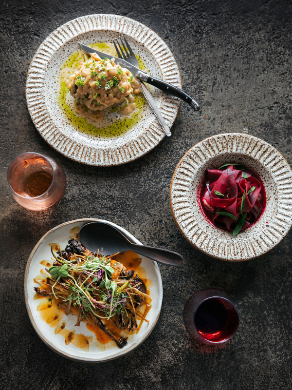 a table-top view of food plates at Karrikin, Yamba