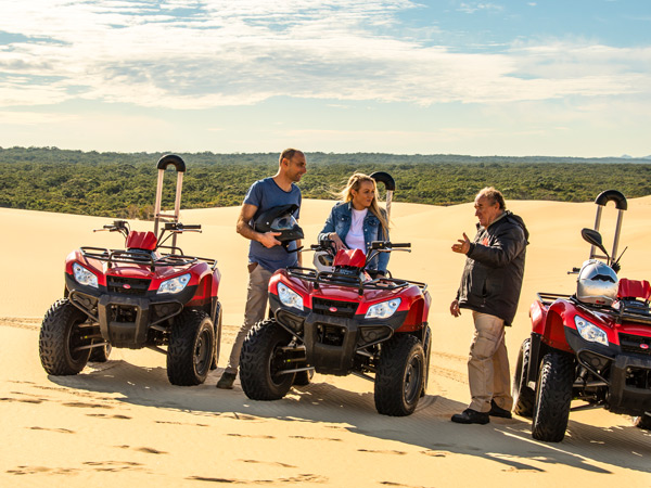 a guide briefing visitors before the quad bike tour, Sand Dune Adventures