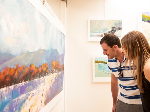 Couple looking at artwork at Shep's Studio in Kingscote on Kangaroo Island.