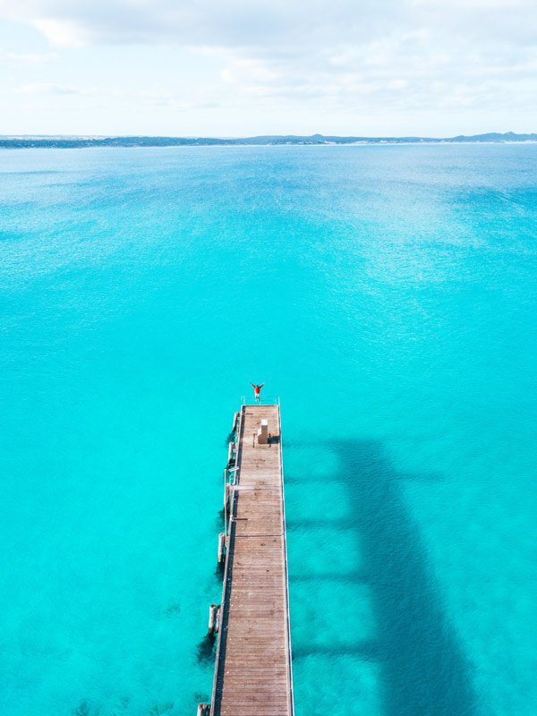High shot of Vivonne Bay Jetty and the turquoise water around it.