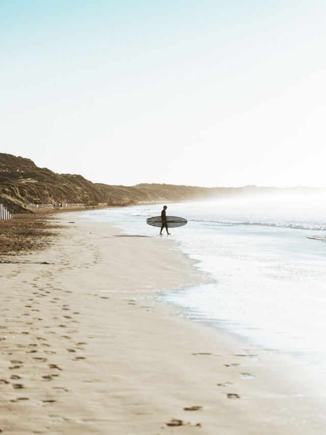 a surfer on Ocean Grove Main Beach
