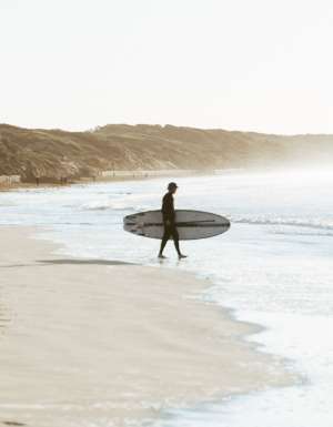a surfer on Ocean Grove Main Beach