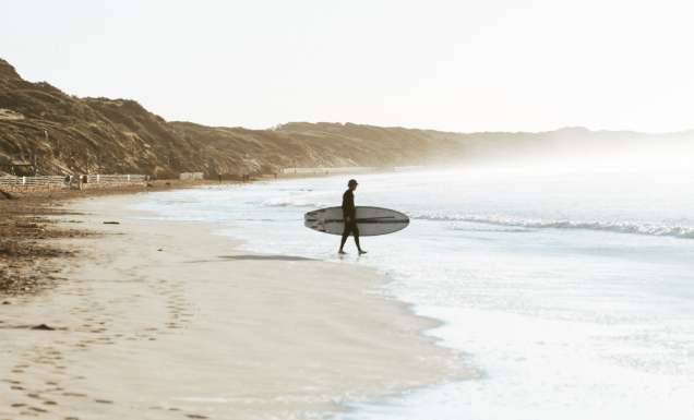a surfer on Ocean Grove Main Beach