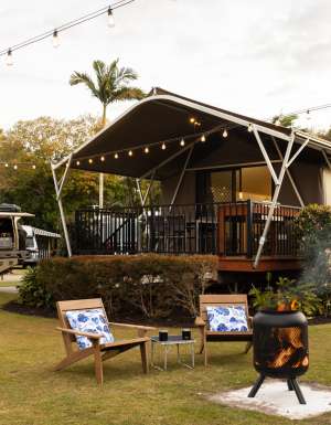 a bonfire setup outside a safari tent at Discovery Parks – Fraser Street, Hervey Bay