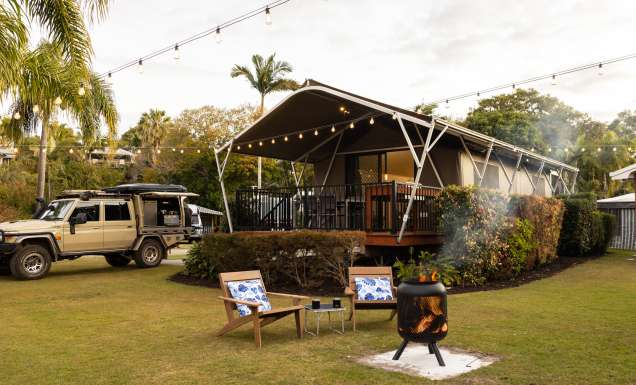 a bonfire setup outside a safari tent at Discovery Parks – Fraser Street, Hervey Bay