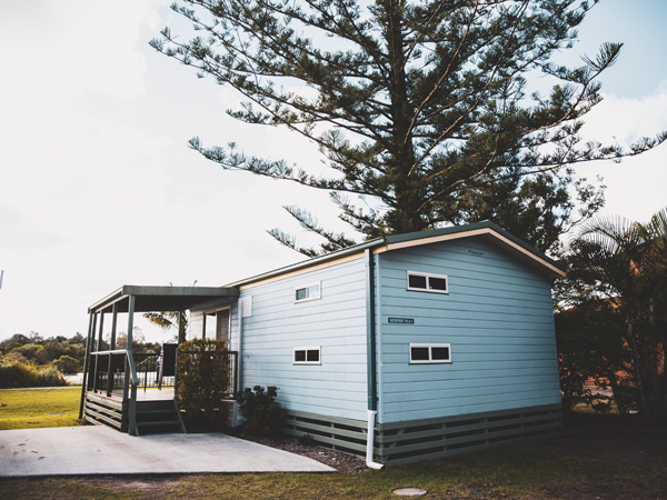 a rustic cabin at Calypso Yamba Holiday Park