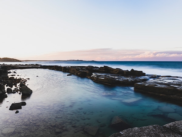Scenic coastal views across Angourie Blue Pool, Yamba, NSW, Australia