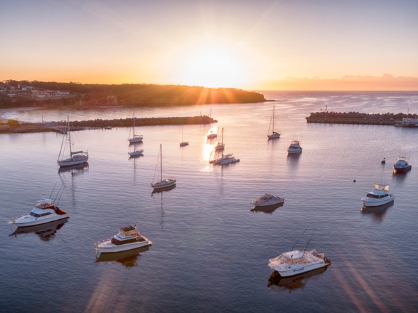 Sunrising over Ulladulla Harbour, Ulladulla. (Image: Destination NSW)