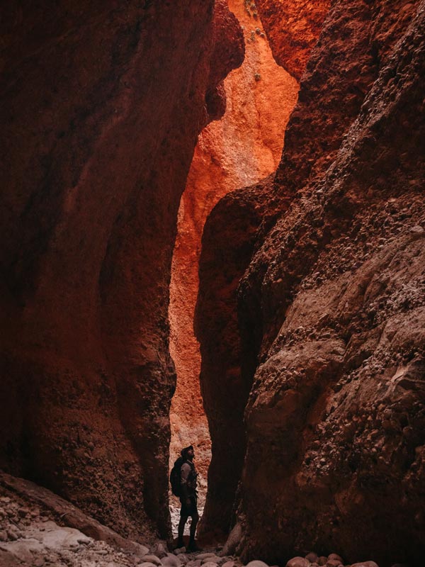 Bush walker exploring Echidna Chasm, Purnululu National Park (Image: Tourism Western Australia)