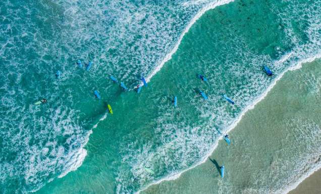 Aerial shot of surfers at Redgate Beach in Margaret River. (Image: Tourism Western Australia)