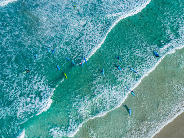 Aerial shot of surfers at Redgate Beach in Margaret River. (Image: Tourism Western Australia)