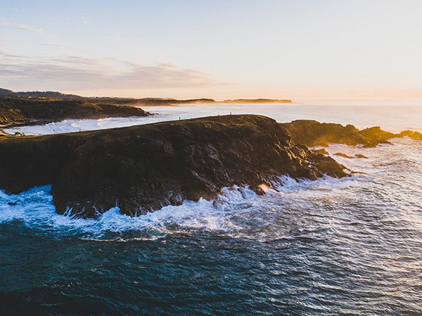 Waves crash against Emerald Beach in NSW, Australia