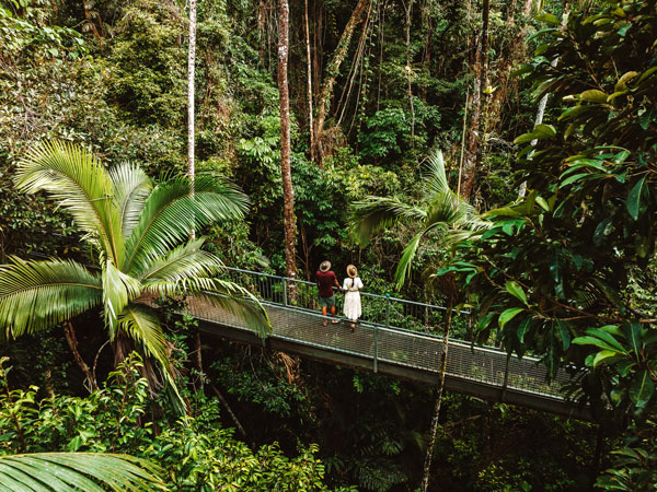 a couple relaxing at Cow Bay, Daintree National Park