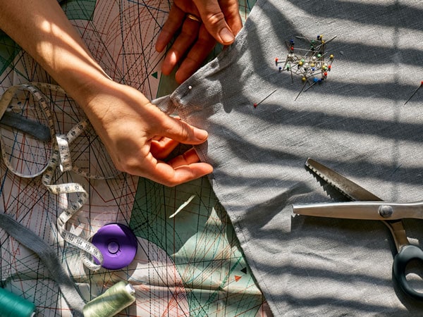Image of woman sewing from Getty