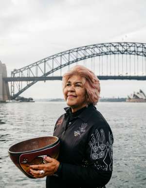 Margret Campbell standing in front of the Sydney Harbour Bridge. (Image: Destination NSW and Margret Campbell)