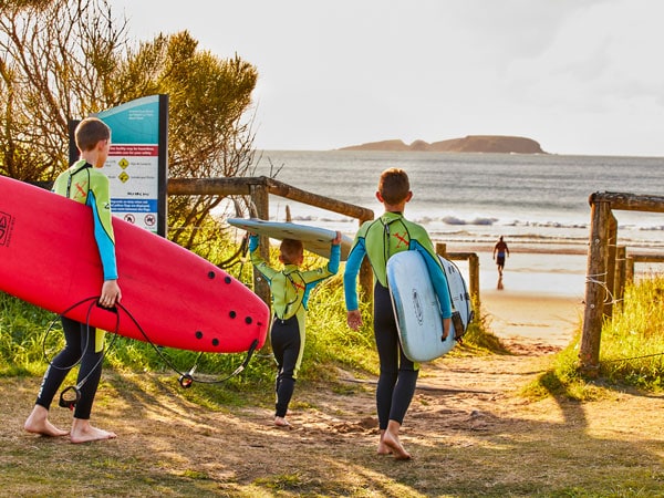 kids holding surfboards at Broulee Surf School
