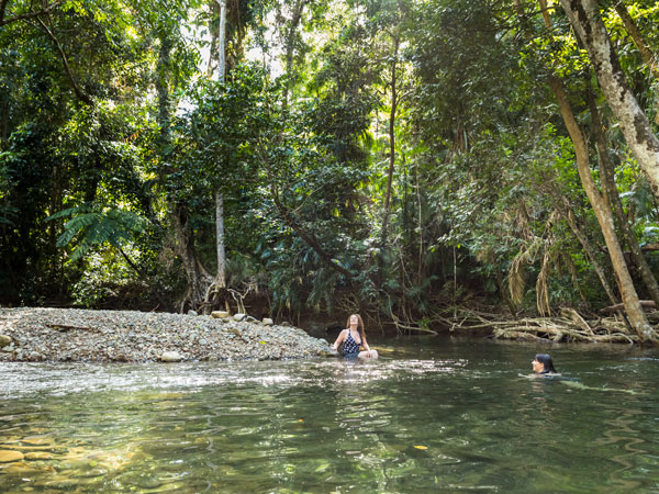 two women relaxing at Emmagen Creek, Cape Tribulation