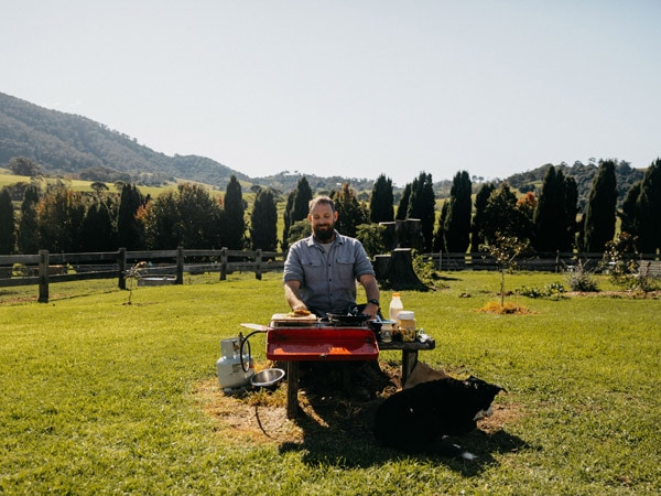 a guy cooking food during the Eurobodalla Food Trail