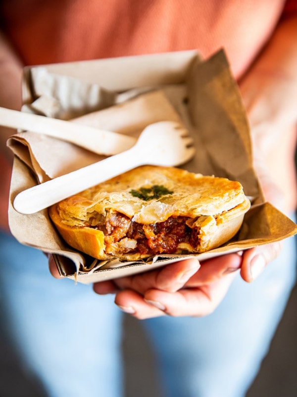 Woman holding Hayden's Pies. 