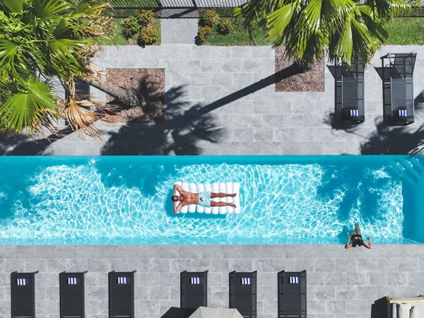 a man floating on the pool at Jackson Ranch, Batemans Bay