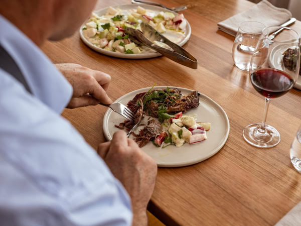 a man enjoying his meal at The Agrarian Kitchen