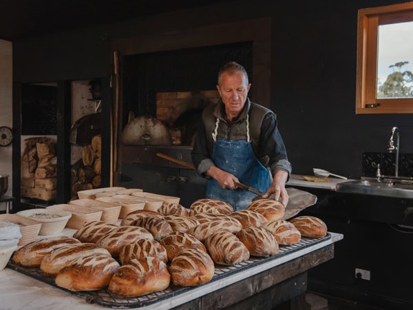a man preparing bread at The Bruny Baker, Hobart
