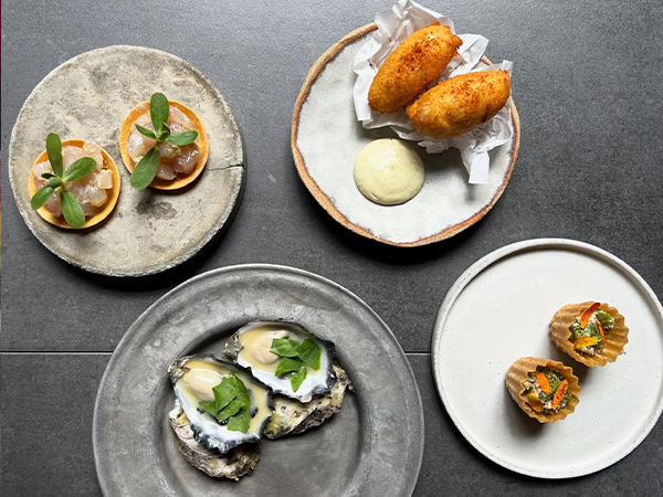 Plates of food at Dier Makr restaurant in Hobart.
