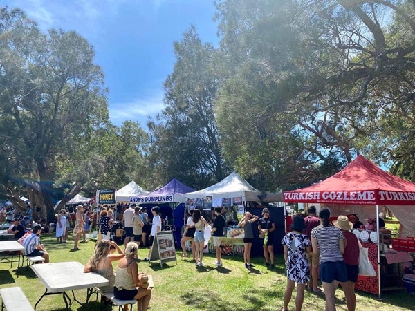 A crowd of people at the Long Jetty Markets in Central Coast, Australia