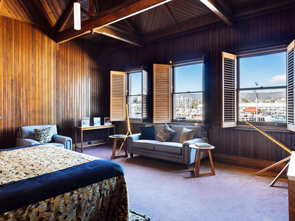 a room with with large windows at The Henry Jones Art Hotel, Hobart
