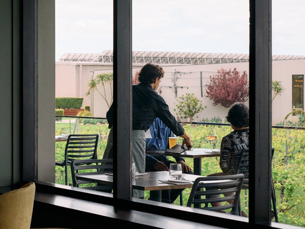 a waiter serving customers outside Amelia Park Restaurant, Margaret River